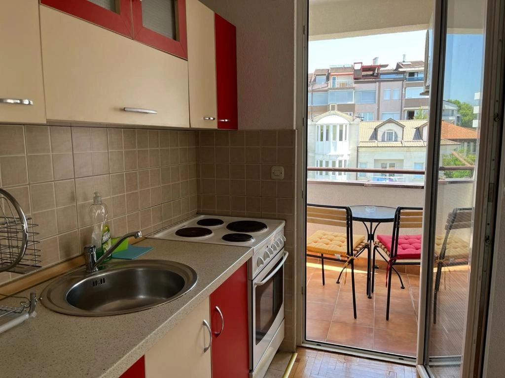 kitchen area and a balcony with a view