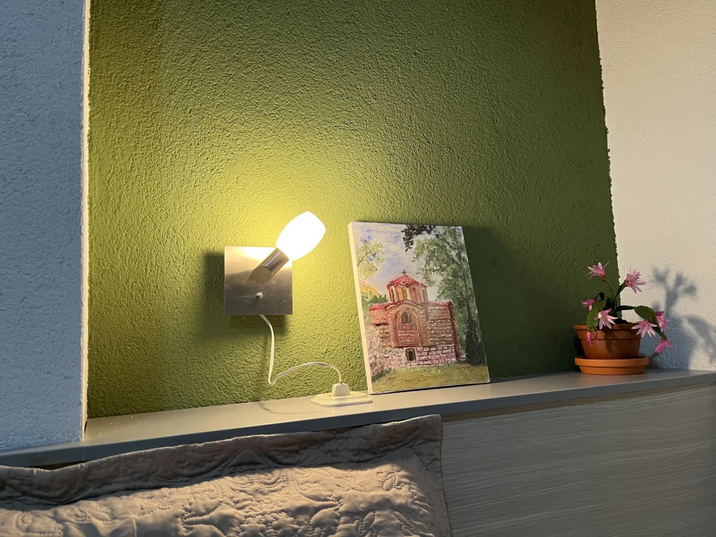 lamp by the bed with a flower painting lamp by the bed with a flower painting