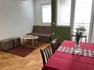 living and dining area with windows