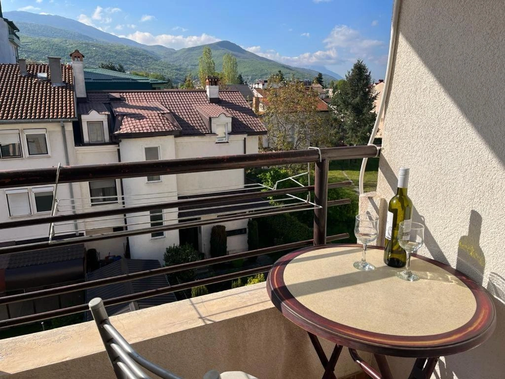 sunny balcony with table and chairs